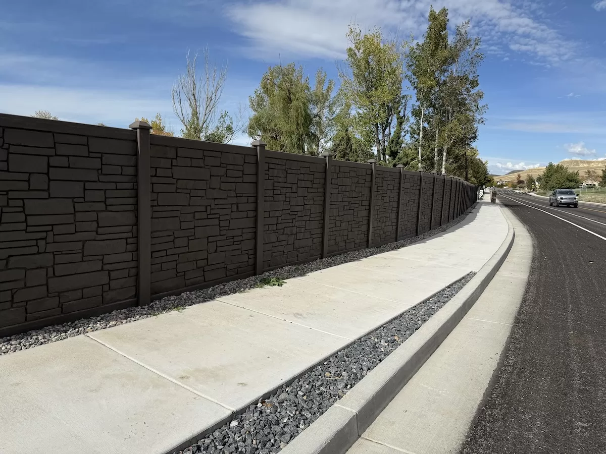 High-Tight-Fencing-privacy-composite-fence-rock-sidewalk High & Tight Fencing installed Simtek composite fence in Hyde Park, Utah